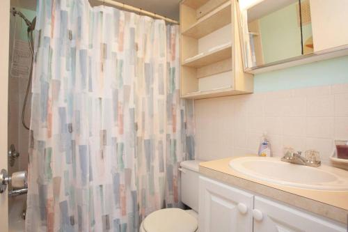 a bathroom with a sink and a shower curtain at Venice Villas * Studio #53 in Venice