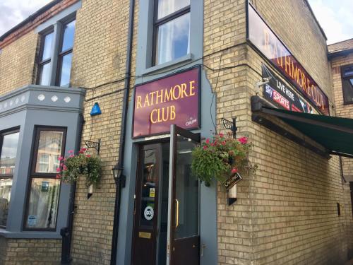 a brick building with a sign that reads architecture club at The Rathmore in Cambridge