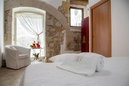 Posteľ alebo postele v izbe v ubytovaní Ortigia Ancient House