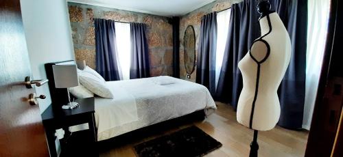 Ein Bett oder Betten in einem Zimmer der Unterkunft Casa de Mirão