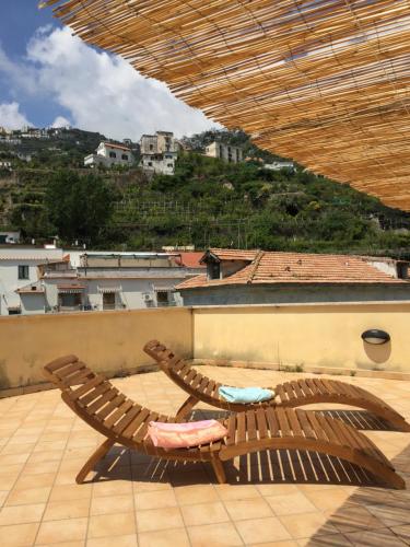 two chairs sitting on top of a roof at Le Case di Don Andrea in Minori