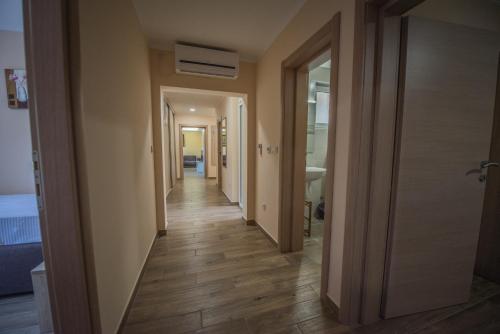 a corridor of a room with a hallway at Apartment Vrutak in Kotor