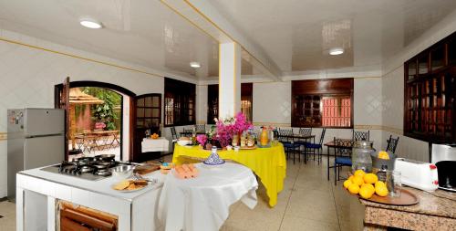 a kitchen with a table with a yellow table cloth at LHOSTEL à Casablanca in Casablanca