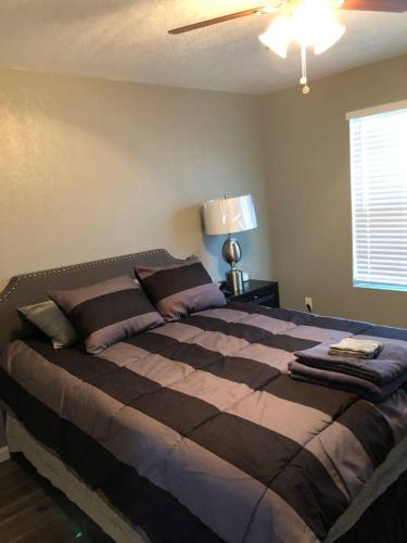 a bedroom with a large bed in a room at Downtown Contemporary yet Cozy Fun in San Antonio