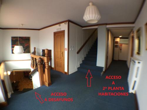 a room with a staircase and a room with a hallway at Hostal Vista Alegre in Castro-Urdiales