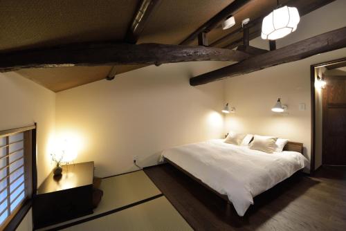 Een bed of bedden in een kamer bij Kyoto - House / Vacation STAY 43519