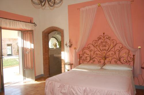 a bedroom with a large bed with a canopy at Fattoria Antognoni in Reggello