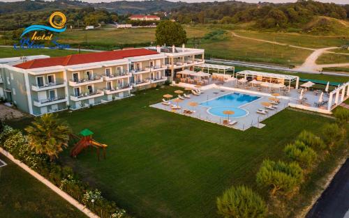 an aerial view of a large house with a swimming pool at Blue Sea Hotel in Kanali