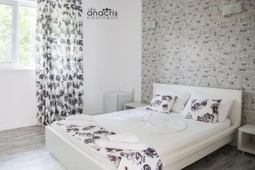 Un pat sau paturi într-o cameră la Anacris Guesthouse