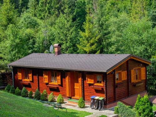a log cabin in the middle of a forest at Drevenice Oščadnica in Oščadnica