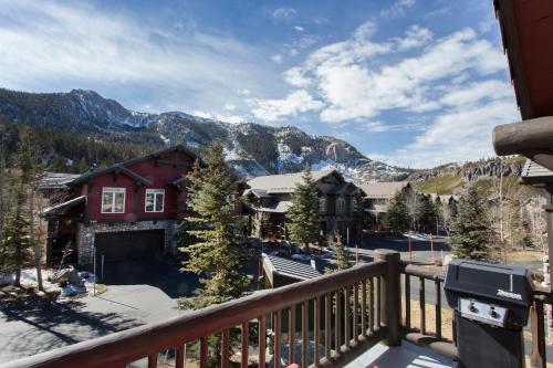 a view from the balcony of a house with mountains at Mammoth Golf Properties By 101 Great Escapes in Mammoth Lakes