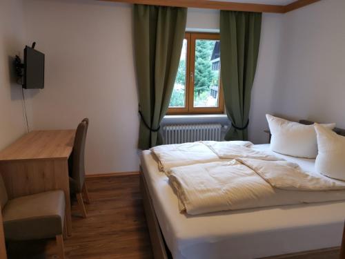 Postel nebo postele na pokoji v ubytování Hotel Oyer Hof - selbst Service