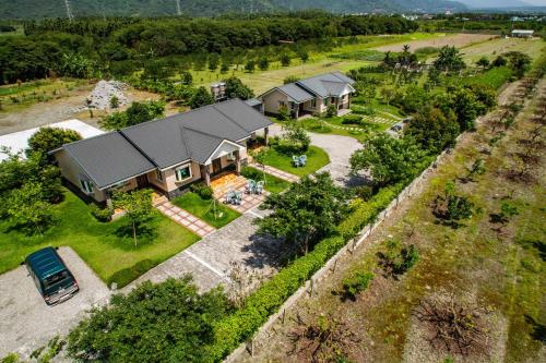 an aerial view of a house with a yard at Countryside B&B in Ruisui