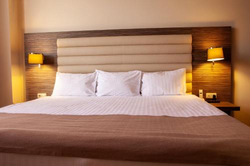 
Кровать или кровати в номере President Hotel by Hrazdan Hotel CJSC
