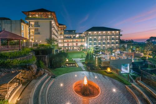 a view of a building with a candle in front of it at Nava Hotel Tawangmangu in Tawangmangu