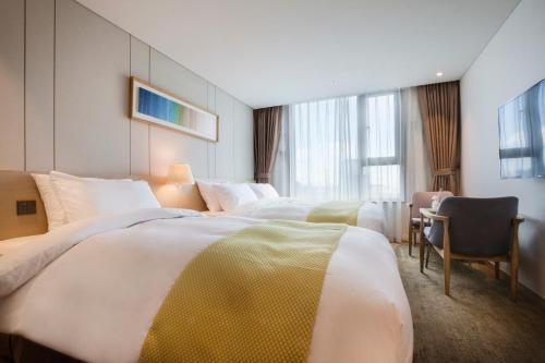 Postel nebo postele na pokoji v ubytování Hotel Winstory