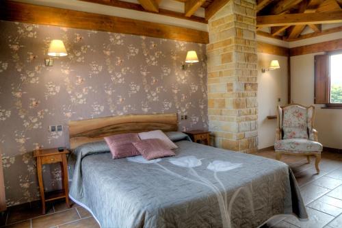 מיטה או מיטות בחדר ב-Hotel Cildá