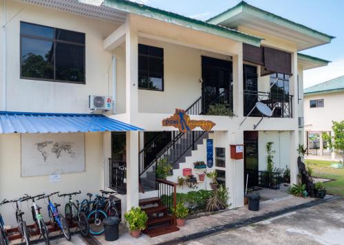a house with bikes parked outside of it at Poni Homestay in Bandar Seri Begawan