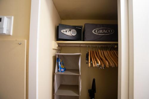 a room with a closet with baseball equipment at 2417 at Oceanfront Resort Lihue Kauai Beach Drive Private Condo in Lihue