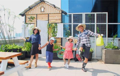 a group of people standing in front of a house at Hotel Horison Ultima Bekasi in Bekasi