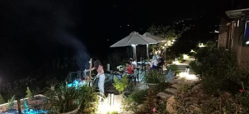 a group of people sitting at a table at night at Sapa Eco Villas & Spa in Sa Pa