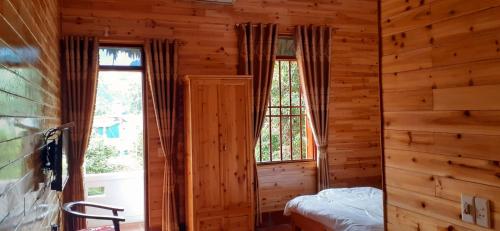 Ένα ή περισσότερα κρεβάτια σε δωμάτιο στο Sa House Bac Ha