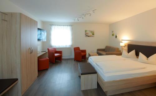 Giường trong phòng chung tại Gasthof zur Sonne