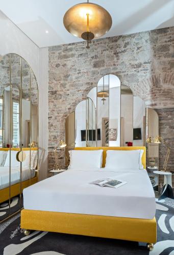 Katil atau katil-katil dalam bilik di Hotel Calimala Florence
