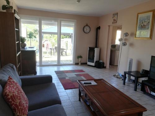 a living room with a couch and a coffee table at Marielu in Pouilly-sur-Loire