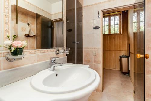 a bathroom with a sink and a shower at Baltic Beach Hotel & SPA in Jūrmala