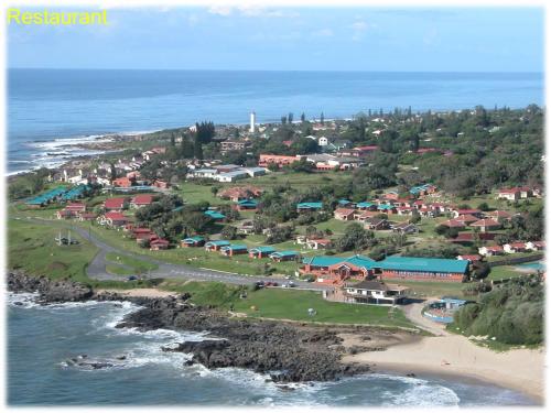 an aerial view of a town next to the ocean at Port Edward Holiday Resort in Port Edward