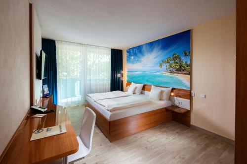 a hotel room with a bed and a painting on the wall at Victory Gästehaus Therme Erding in Erding