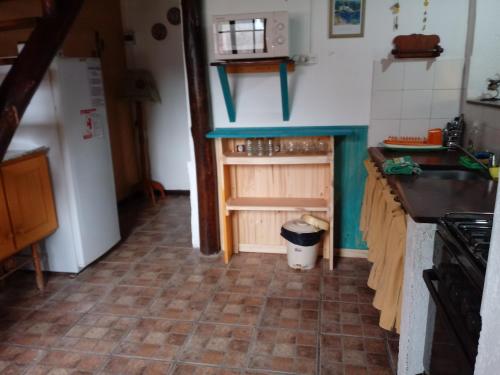 a kitchen with a sink and a counter top at Cabañas Esferas de Cristal in Capilla del Monte