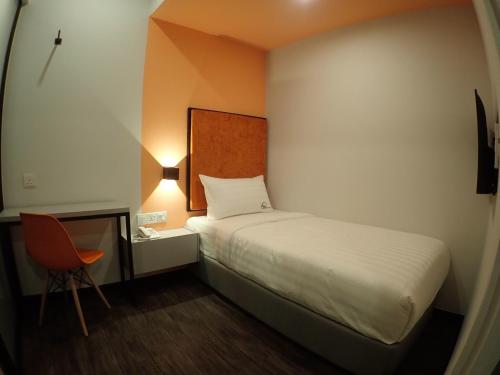 Ένα ή περισσότερα κρεβάτια σε δωμάτιο στο Apex Boutique Hotel @ Bandar Sunway