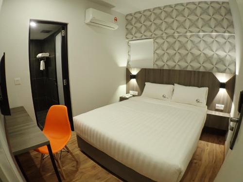 Ένα ή περισσότερα κρεβάτια σε δωμάτιο στο Apex Boutique Hotel @ Bandar Sunway