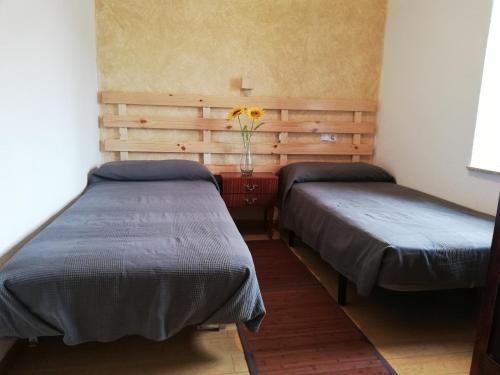 Postel nebo postele na pokoji v ubytování Casa Rural Abuela Tina