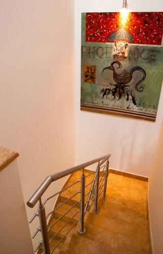 a staircase with a picture of a bird on the wall at Bed & Breakfast Case Osti in Castel Maggiore