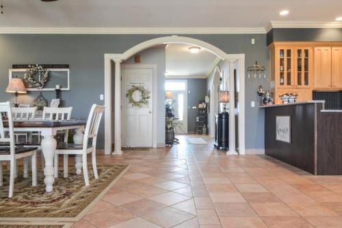 a dining room and kitchen with a table and chairs at Barren Breeze Bed and Breakfast in Lucas