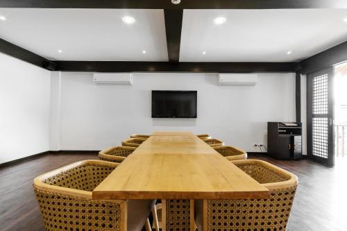 a conference room with a wooden table and chairs at El Nido Resorts Miniloc Island in El Nido