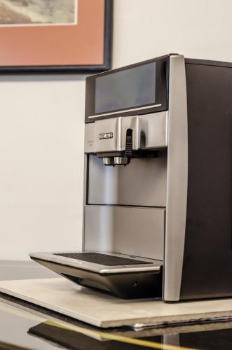 a coffee machine sitting on top of a table at Somerset View Guest House in Somerset West