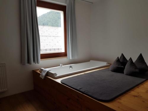 Ein Bett oder Betten in einem Zimmer der Unterkunft Hotel Hinteregger