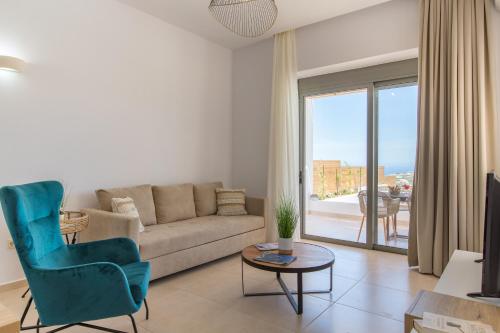 a living room with a couch and a table at Kallixeni Villas in Rethymno Town