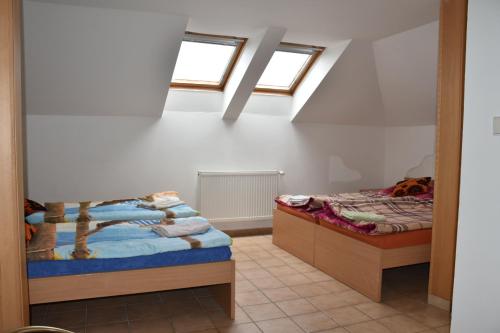 Postel nebo postele na pokoji v ubytování Penzion-Bar Sandra