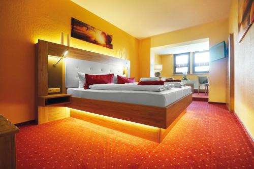 Ein Bett oder Betten in einem Zimmer der Unterkunft Hotel und Restaurant Bühlhaus