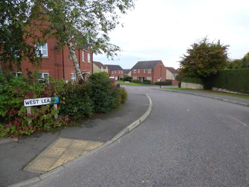 a street sign on the side of a road at West Lea House in Chesterfield