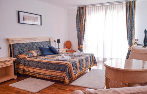 Lova arba lovos apgyvendinimo įstaigoje Hotel Villa Strassoldo "Ex Attianese Hotel Restaurant"