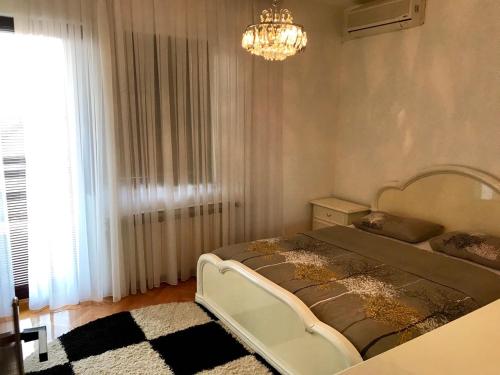 A bed or beds in a room at Apartments Dreams Centar