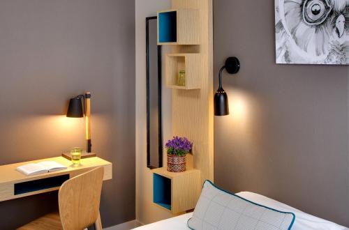 Ein Bett oder Betten in einem Zimmer der Unterkunft Chouette Hotel