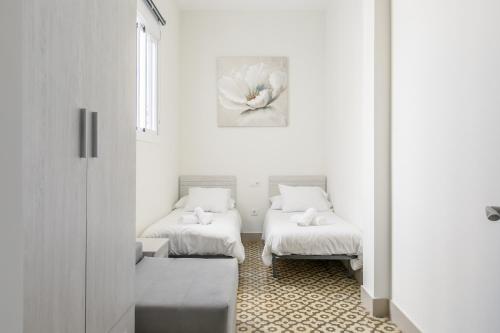 A bed or beds in a room at AoA San Lorenzo Apartment