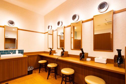 a barber shop with stools and mirrors at U-Neru in Narashino